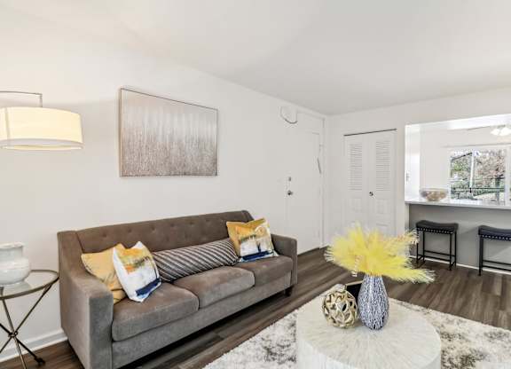 a living room with a couch and a table at Oaks at Oxon Hill, Oxon Hill, Maryland