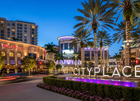 A sign that says Cityplace in front of a building.