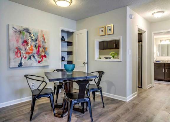 A dining room with a table and chairs at The Onyx Hoover Apartments, Hoover, AL, 35216