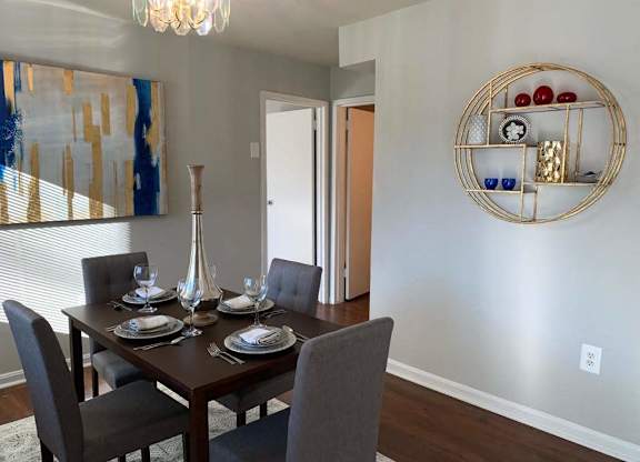 a dining room with a table and chairs at The Glendale Residence, Lanham, Maryland
