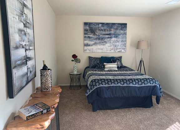 a bedroom with a bed and a nightstand at The Glendale Residence, Lanham, MD, 20706