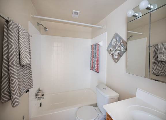 a bathroom with a sink toilet and bathtub at The Glendale Residence, Maryland, 20706