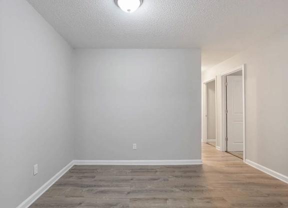 A room with a light on ceiling and a door on the right at The Onyx Hoover Apartments, Hoover, AL, 35216