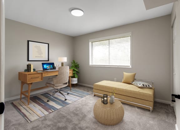 bedroom with couch and desk at Flats of Forestville, Forestville, Maryland 20747