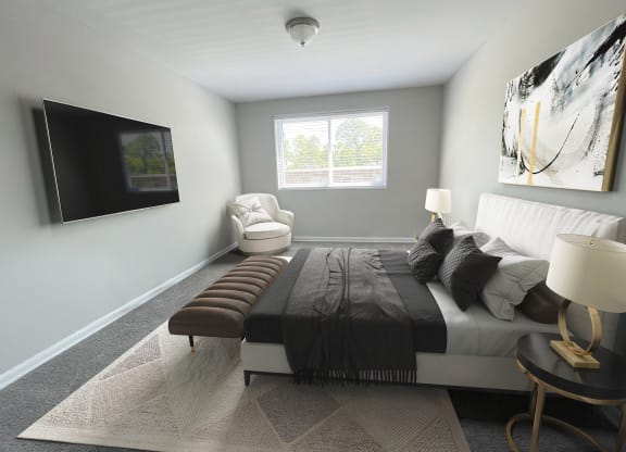 Bedroom with TV set at Flats of Forestville, Forestville, Maryland