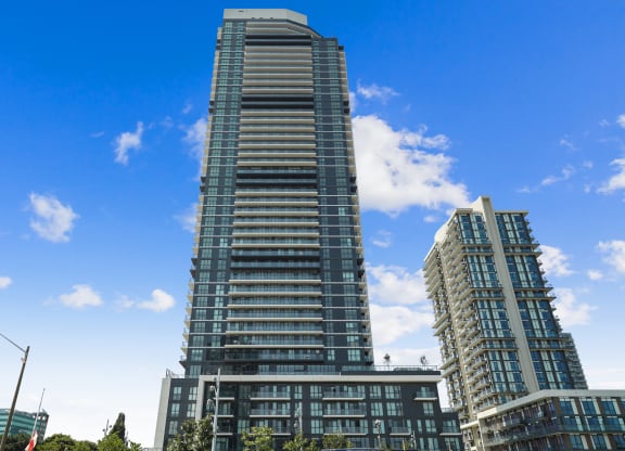 a tall building with a blue sky in the background