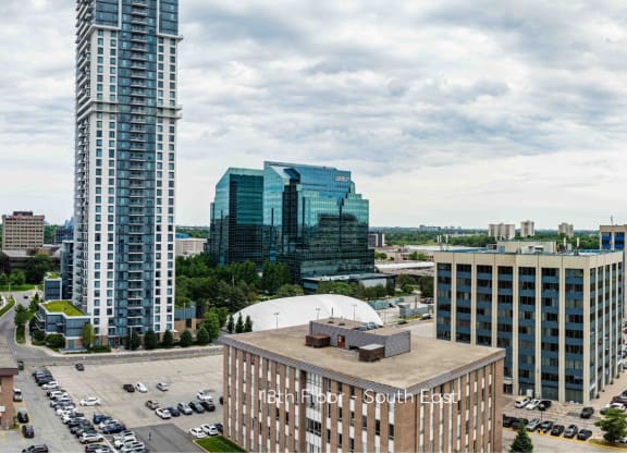 a cityscape of a city with tall buildings and cars