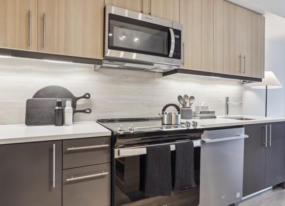 a kitchen with a stove and a microwave