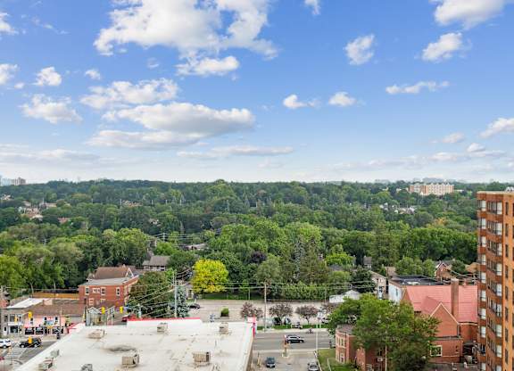 the view of the city from the roof of a building