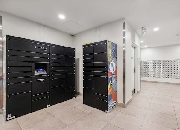 a utility room with black lockers and a vending machine
