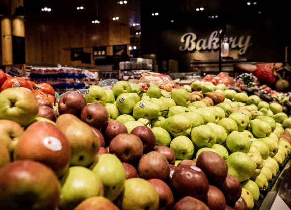 red apples and green apples on display next to each other