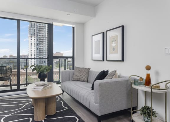 a living room with a couch and a large window
