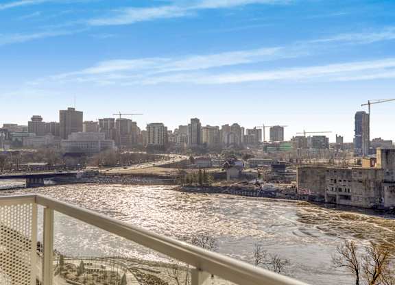 A cityscape with a frozen river in the foreground.