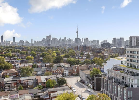 a cityscape of toronto with the cn tower in the distance