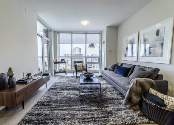 a living room with a couch and a large window