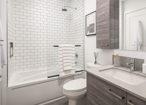 bathroom with full bath and shower