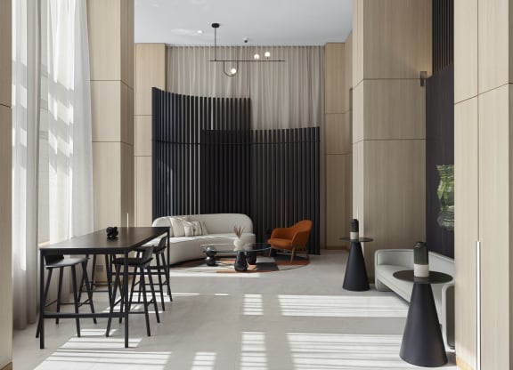 a living room with a table and chairs and a couch