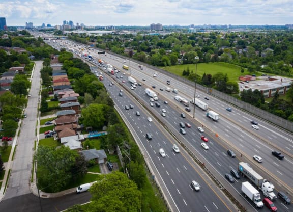 a busy highway with cars and trucks on it