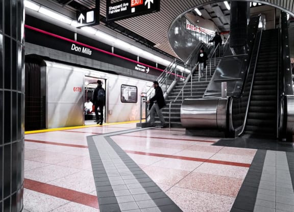 people walking up and down the stairs in a subway station