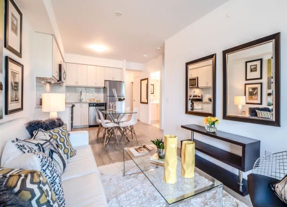 a living room with a couch and a glass table