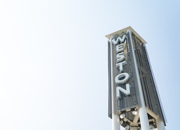 A tall white sign with the word