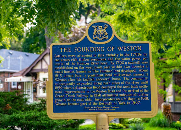 A blue sign with white text reads