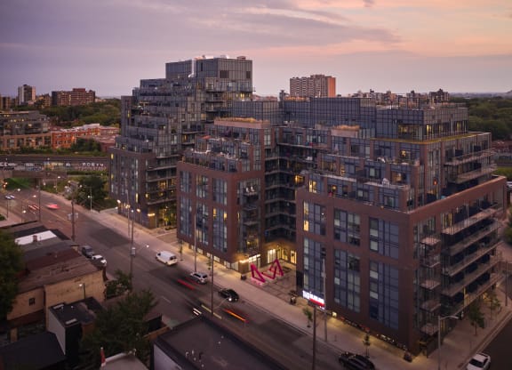 an aerial view of a city street at dusk