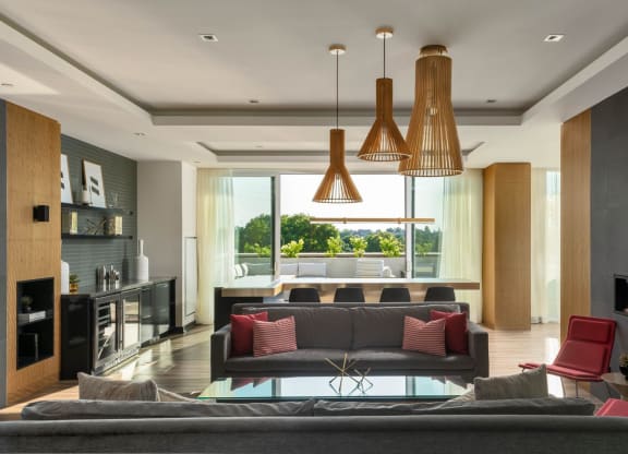 a living room with a couch and a table with chairs