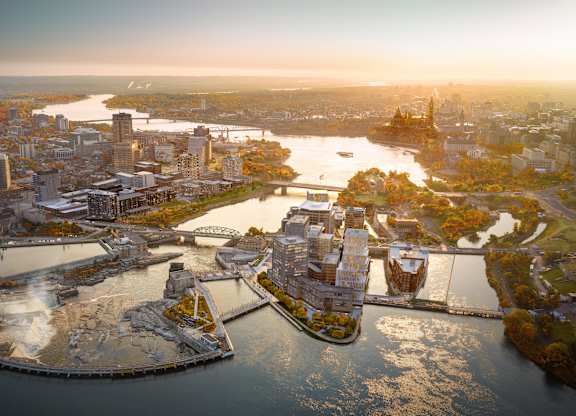 an aerial view of the city and the river
