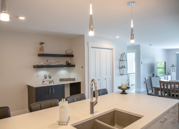 a kitchen with a sink and a counter top in a house