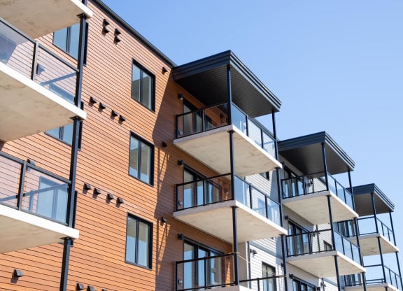 modern apartment buildings against a blue sky