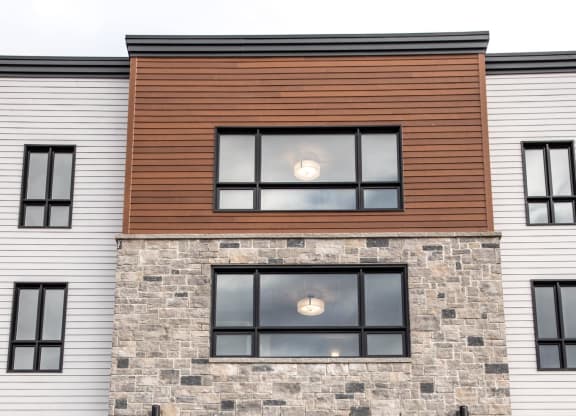 the front of a condo building with a glass door