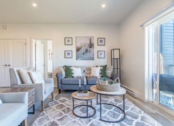 a living room with couches and chairs and a table
