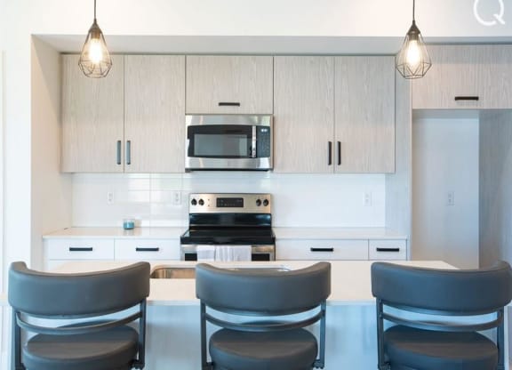 a kitchen with a table and chairs