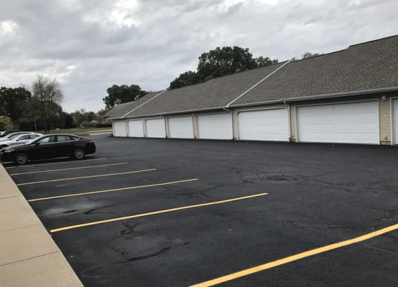 a parking lot with a building in the background