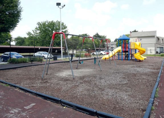 a playground with a slide and monkey bars