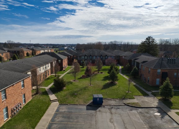 an aerial view of a neighborhood with houses and trees