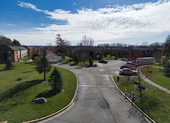 an aerial view of a neighborhood with a road and houses