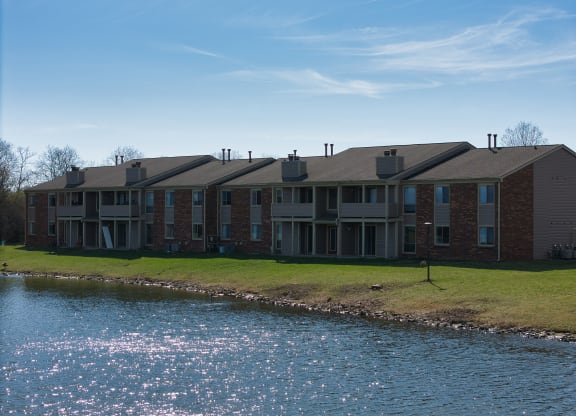 an apartment building overlooking a body of water