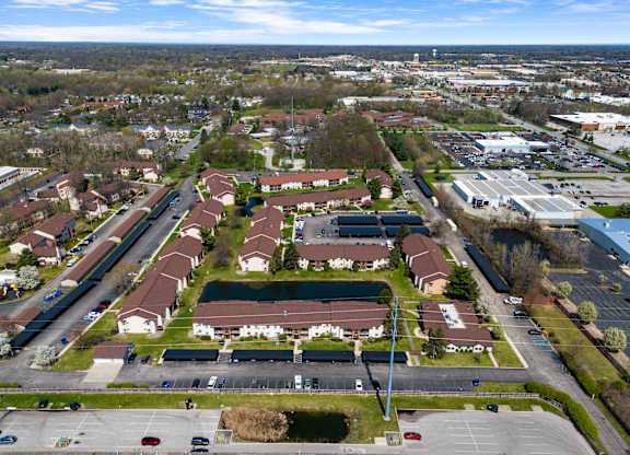 an aerial view of a neighbourhood of houses and a parking lot