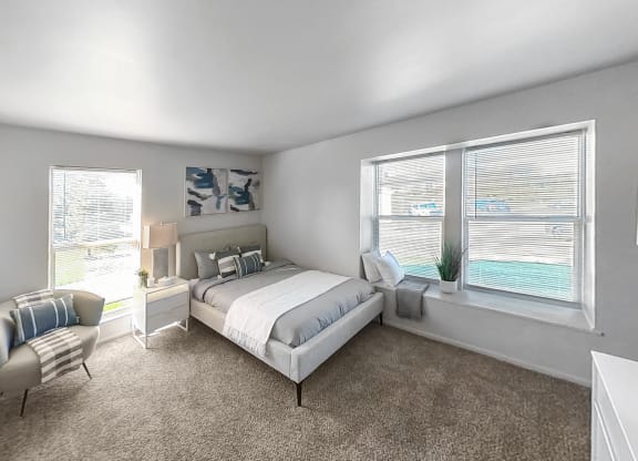 a bedroom with a bed and two windows