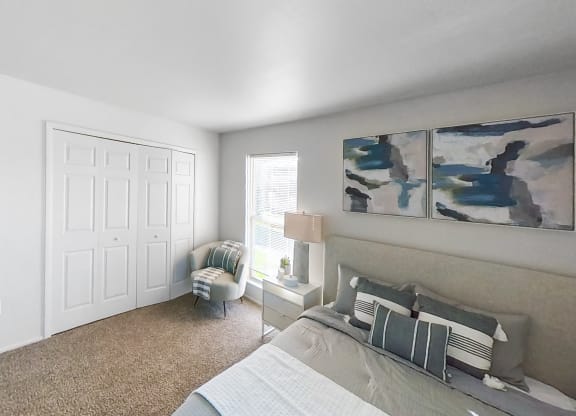 an open living room with a couch and a window