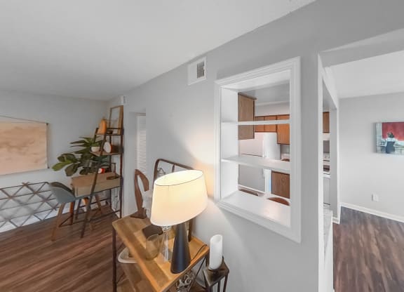 a dining room with a table and chairs and a window
