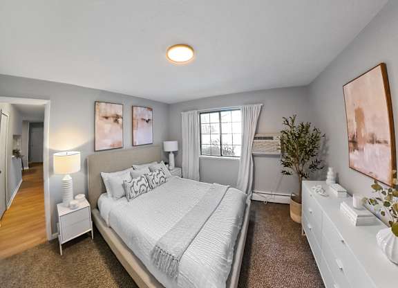 a bedroom with a large bed and a closet