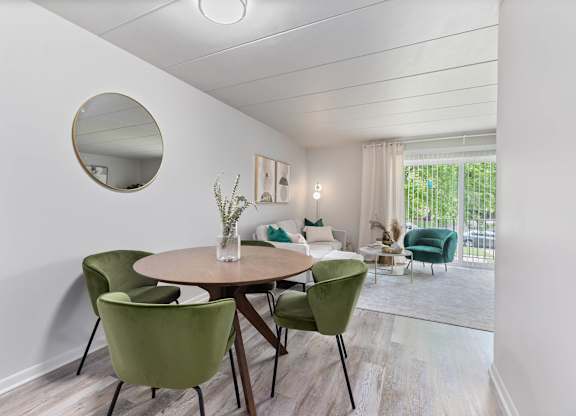 a dining room with a table and chairs