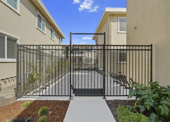 Steel gate and bike racks at Parkside Apartments, Davis, 95616