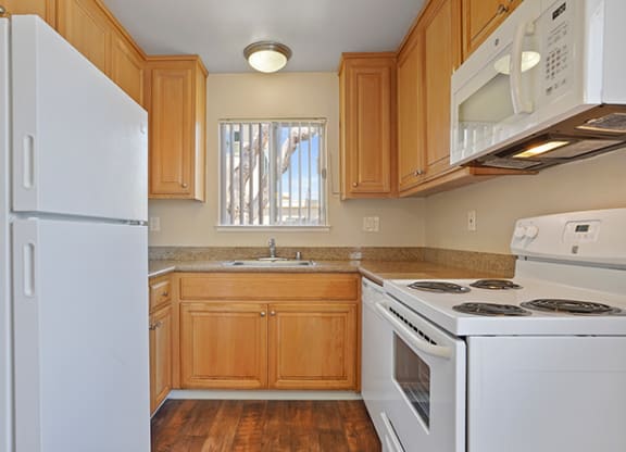 White Appliances In Kitchen at Colonial Garden Apartments, San Mateo, California