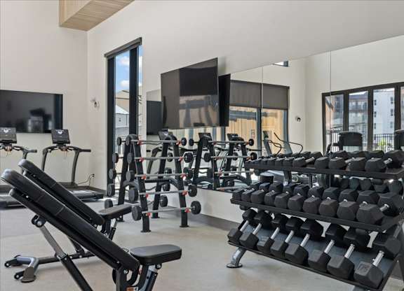 Gym with free weights at Solhavn Apartments, American Fork, UT