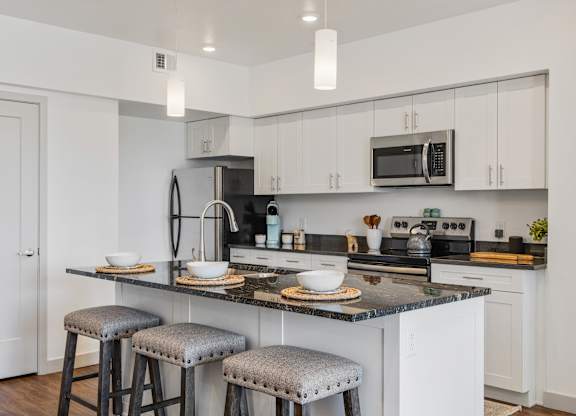 Kitchen with stove top oven at City View St. George, St. George, UT