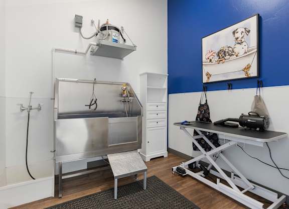a small room with a sink and a table and a refrigerator at City View St. George Apartments, Utah
